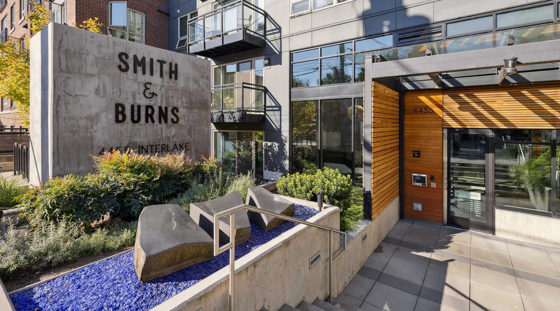 entrance with signage and landscaping